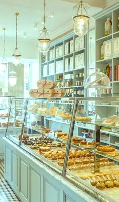 a bakery filled with lots of different types of pastries and desserts on display