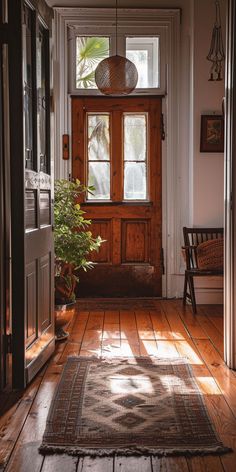 Modern farmhouse hallway with a blend of rustic wood and contemporary design Modern Farmhouse Hallway, Farmhouse Hallway Decor, Farmhouse Hallway, Rustic Entryway, Warm Decor, Hallway Design, Hallway Decor, Open Door, Modern Farmhouse Decor