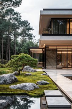 the house is surrounded by rocks and grass