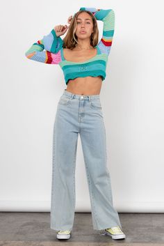 The Blue Jean Baby Jeans features a 90's inspired denim design with high waist, wide leg and made from an ultra soft denim. Worn With The France In Spring Cardigan. Color: Light Denim High Waist Wide Leg Raw Edge Hem Front & Back Pockets 100% Cotton Models are 5'4 - 5'9" and wearing size Small. These can be cute to desired length. Size Up For Looser Fit Trendy Cropped Denim Pants, Blue Cropped Bottoms With Five Pockets, Trendy Cropped Denim Blue Bottoms, Blue Trendy Relaxed Fit Flare Jeans, Casual Cropped Denim Blue Flare Jeans, Casual Cropped Light Wash Bottoms, Trendy Medium Wash Cropped Bottoms, Trendy Blue Relaxed Fit Flare Jeans, Trendy Cropped Dark Wash Pants