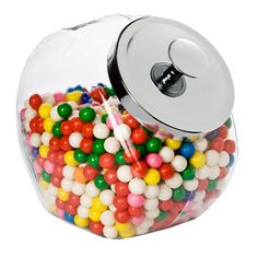 a glass jar filled with lots of colorful candies and a metal lid on top