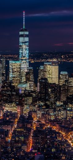 the city lights shine brightly at night in this view from top of the empire building