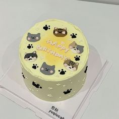 a birthday cake with cats and dogs on it