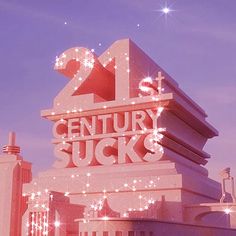 the 21st century sucks sign is lit up in red and white with stars on it