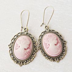 Lady silhouette cameo earrings. This lovely yet rose cameo earrings are just divine. This lovely piece of jewelry measures to fit a 25x18 mm cameo and comes with great antique toned french hook style dangle earrings. These gorgeous earrings measure 1 3/4 inches in length and would be the perfect gift for you or someone special. Cameo necklace: https://www.etsy.com/listing/500220724/pink-cameo-necklace-silver-letter?ref=shop_home_active_9&pro=1&frs=1 Cameo bracelet: https://www.etsy.com/listing/6 Cameo Earrings For Gift, Victorian Style Pink Earrings For Gift, Pink Victorian Earrings For Gift, Victorian Cameo Earrings For Gift, Vintage Pink Nickel-free Earrings, Antique Cameo Earrings Gift, Antique Cameo Earrings As Gift, Antique Cameo Earrings For Gift, Antique Pink Earrings Gift