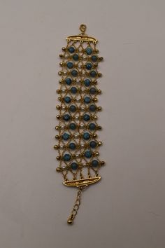 This is a super pretty vintage Avon bracelet. It is mostly gold with some blue/teal beads. Blue Bracelets With Gold Beads For Jewelry Making, Metal Beaded Bracelets For Costume Jewelry, Beaded Metal Costume Jewelry Bracelets, Beaded Metal Bracelets Costume Jewelry, Metal Beaded Costume Jewelry Bracelets, Blue Gold Beaded Bracelet, Blue Gold Beads Bracelet, Gold Bohemian Pearl Bracelet, Elegant Turquoise Beaded Metal Bracelets