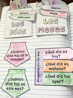 an open notebook with spanish words and pictures on the pages, in front of them