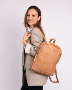 Introducing the Bekema leather backpack, expertly crafted from premium quality leather to meet the highest standards of durability and style. Featuring a soft diamond patterned texture, it exudes refined elegance.The clean lines and understated design make it perfect for those who appreciate a minimalist approach to fashion. PRODUCT DETAILS Dimensions: 10.2" L x 3.5" W x 14.2" H Material: Premium Leather Closure: Zipper Compartments: 2 Pockets / inside: 1 (1 zippered ) Strap handle drop: 8.7" Sh Luxury Quilted Backpack For Travel, Luxury Quilted Travel Backpack, Elegant Soft Leather Backpack For On-the-go, Elegant On-the-go Soft Leather Backpack, Versatile Quilted Leather Bag, Quilted Backpack For Daily Use, Quilted Standard Backpack For Daily Use, Quilted Leather Backpack For Everyday Use, Elegant Everyday Backpack In Soft Leather