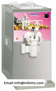 an ice cream machine sitting on top of a metal counter next to a pink background