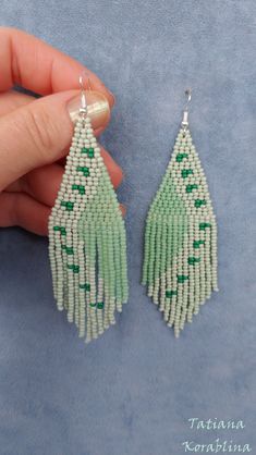 These handmade author's earrings are made of high-quality Czech beads and strong synthetic thread. In these unique earrings I use my author's scheme (Abstract minimalism). They are elegant, fashionable, and highly versatile, suitable for everyday wear. Color: pastel green(mint),emerald. 100% hand made with love! Measurements: Length- near 10.5cm(3.94inch),Width -3 cm(1.18 inch) Materials: Sterling silver components Czech glass beads Tytan Thread Thank looking on my work! Green Beaded Earrings For Beach, Bohemian Green Beaded Earrings, Green Handwoven Beaded Dangle Earrings, Nickel-free Green Beaded Earrings For Beach, Unique Green Beaded Nickel-free Earrings, Chandelier Boho, Mint Earrings, Pastel Earrings, Earrings Chandelier