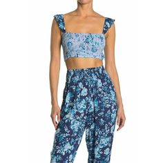 Nanette Lepore Suzie Blue Floral Smocked Ruffle Crop Top Sleeveless Women's L This Cute Cropped Floral Top With Smocked Sleeves Is The Perfect Versatile Top For A Beach Day Or Any Day. - Allover Print - Smocked Sleeves - Ribbed Bodice - Slip On Style - Approx. 8" Back Length, 15" Across Chest Machine Wash 100% Viscose Item #6456003 Chic Smocked Sleeveless Top With Elastic Waistband, Chic Sleeveless Smocked Top With Elastic Waistband, Sleeveless Smocked Top With Elastic Waistband For Vacation, Chic Sleeveless Smocked Top With Floral Print, Sleeveless Smocked Top With Elastic Waistband For The Beach, Summer Sleeveless Smocked Top With Floral Print, Sleeveless Smocked Top With Floral Print For Day Out, Sleeveless Floral Print Smocked Top For The Beach, Sleeveless Smocked Top With Floral Print For The Beach