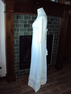 "Beautiful White Modest Linen And Venetian Lace Bridal Gown Size XS- S Excellent Vintage Condition, No Rips Or Tears, A Few Light Stains On The Bottom Inside Lining Of Train Fully Lined Empire Waist Dress Elbow Length Sleeves Rounded Boat Neckline Back Metal White Zipper (Zips Fine Too Small For My Dress Form) 6\" X 1.75\" White Bow Attached In Back Several Rows Of 3-5\" Venetian Lace Lace Is Slightly Differnt Shade Of White Very Fitted Bodice With Darts And Venetian Lace Around Empire Waist A L Regency Style White Wedding Dress, Full Length Victorian Dress For Wedding, Fitted Wedding Dress With Lace Trim For Debutante Ball, White Historical Design Wedding Dress, Fitted Lace Victorian Dress With Empire Waist, White Fitted Gown With Historical Design, Fitted White Gown With Historical Design, Floor-length Victorian Dress With Historical Design For Wedding, White Victorian Empire Waist Wedding Dress