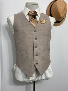 Goodmorning! 1940s vintage brown wool/laine beige brown country club vest/ waistcoat. The vest waistcoat features five-button front closure, and two slanted jetted  hip pockets and two front pocket. This is a great gift and great find. Estimated size: 36 : Please see measurement below , for best fit compare measurement with similar vest waistcoat or item. Armpit to Armpit: 19" Front Length: 22" Condition: Pre-owned and in a well-off-taking care condition. For the age of this vest, it's very well Brown Business Vest With Notch Lapel, Brown Notch Lapel Vest For Business, Semi-formal Brown Three-piece Suit With Welt Pockets, Tailored Brown Vest With Notch Lapel, Brown Three-piece Suit For Semi-formal Events, Brown Three-piece Suit For Semi-formal Occasions, Brown Semi-formal Three-piece Suit, Brown Notch Lapel Vest For Semi-formal Occasions, Brown Semi-formal Vest With Notch Lapel