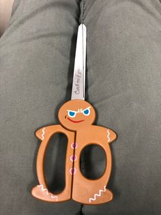 a pair of scissors sitting on the back of someone's pants with their legs crossed