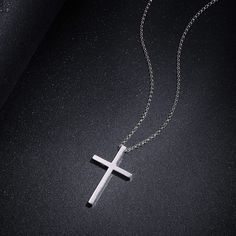 This sleek cross pendant adds protection and a unique look to your wardrobe. This elegant cross is a meaningful look you will appreciate. Discover all our sleek 925 silver jewelry for men and find a gift for him here. Materials: Made with white gold plated 925 sterling silver on a sterling silver rolo chain. Necklace Chain: 23.6 inches (60cm) long. Pendant Size: 36 x 20 mm. Chain Type：Rolo Chain Clasp Type: Lobster Claw Minimalist Stainless Steel Cross Pendant Necklace, Minimalist Silver Cross Necklace, Minimalist White Gold Cross Necklace, Silver Mens Necklace, Silver Jewelry For Men, Sterling Silver Cross Necklace, Mens Necklace, Mens Silver Necklace, Jewelry For Men