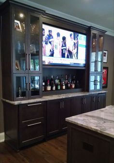 a large entertainment center in a home bar