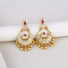 Add elegance and sophistication to your attire with this exquisite Silver Earring featuring a Semi Diamond Stone Chandhbali design. Made with 92.5 Silver and 24 kt gold plating, this stylish piece is adorned with semi-precious stones for a captivating look. Suitable for any occasion, from formal to casual. Height-48 mm width-32 mm   Note Product Care: To maintain the elegance of your silver jewelry, proper care is essential. Keep it away from sweat, water, and sleep to avoid tarnishing. Also, av Gold Dual-tone Chandbalis, Elegant Gold Chandbalis For Reception, Gold Dual-tone Kundan Earrings, Gold Dual-tone Danglers, Gold Cutdana Dangle Danglers, Gold Jhumkas With Dangling Beads, Gold Chandbalis With Dangling Beads For Wedding, Festive Gold Jhumkas With Dangling Beads, Elegant Dangling Beads Earrings For Diwali