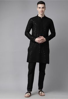 Rayon Kurta in Black This Readymade Chinese Collar Neck and Full Sleeve attire is Enhanced with Resham and Sequins Work Available with a Poly Cotton Pajama in Black Do note: Footwear shown in the image is for presentation purposes only. Half to one inch may vary in measurement. (Slight variation in actual color vs. image is possible) Festive Long Sleeve Sequin Kurta, Long Sleeve Traditional Wear With Sequins For Eid, Traditional Long Sleeve Celebration Wear With Mirror Work, Traditional Long-sleeve Sequined Wear For Eid, Long Sleeve Sequined Traditional Wear For Eid, Sequined Long Sleeve Traditional Wear For Eid, Long Sleeve Kurta With Mirror Work For Celebration, Black Embellished Kurta For Festive Occasions, Festive Embellished Black Traditional Wear