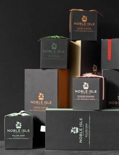 the noble isle packaging is stacked on top of each other in different colors and sizes