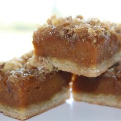 three pieces of pie sitting on top of a white plate