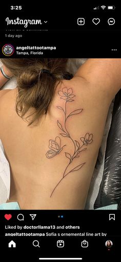 the back of a woman's shoulder with flowers on her left arm and an instagram