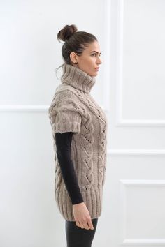 "Make a great first impression without saying a word with our soft wool turtleneck sweater vest . Crafted from high quality wool , that's comfortable and elegant at the same time, this design has a distinctive and stylish appeal. DETAILS - Made from 100% wool - The model is 170 cm tall (regular S) - The sweater on picture is size M-L with extended length - As mostly all models in our shop the sweater is loose fit - Color on photo - ligth brown FOR MORE For all our listings visit - https://www.et Beige Knitted Turtleneck Sweater, Winter Crew Neck Knit Sweater Vest, Fitted Hand Knitted Sweater Vest For Winter, Winter Knit Sweater Vest, Hand Knitted Winter Sweater Vest, Cozy Hand-knitted Sweater Vest For Winter, Cozy Hand Knitted Sweater Vest For Winter, Sweater Vest Vintage, Chunky Turtleneck Sweater