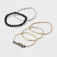 From days at the office to weekend brunch with friends, accessorize any of your looks with this 5-Piece Mixed Semi-Precious Black Howlite Cylinder Beaded Bracelet Set from Universal Thread™. The set features two semi-precious howlite cylinder bracelets plus three golden metallic bracelets, adding a lovely look whether you wear them all together or one at a time. The pull-on design makes them easy to wear, and the simple design pairs just as well with a little dress as with a denim jacket over a Weekend Brunch, Metal Bracelets, Little Dresses, Universal Thread, Metallic Accents, Gold Black, Bracelet Set, Beaded Bracelet, Simple Design