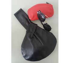 "Stylish leather wristlet, reversible handbag allows you to wear the same bag in two different color options. -The leather on one side is black, and the reverse side can be red, gray, brown, or beige. -Easily reversible soft leather. -Big enough to carry your phone, wallet, keys, lipstick... -Size 9\" x 12\" (23 x 31 cm)" Chic Black Reversible Bags, Reversible Black Leather Shoulder Bag, Black Leather Reversible Shoulder Bag, Iphone Bag, Knot Bag, How To Make Shorts, One Bag, Leather Wristlet, Phone Wallet