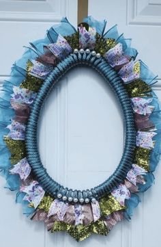 a blue wreath hanging on the front door