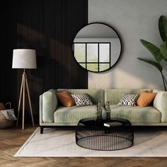 a living room filled with furniture and a round mirror