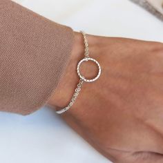 Minimalist hammered open circle Karma ring bracelet. Perfect minimal friendship bracelet gift for women. ▸▸ Materials ◂◂ - Silver: all components are sterling silver 925. - Gold: charm is a high-quality 18k gold coating over sterling silver.  Chain, findings and spring clasp are all 14k gold filled. - Rose Gold: charm is high-quality rose gold coating over sterling silver.  Chain, findings and spring clasp are all 14k rose gold filled. ▸▸Ring size▸▸ 14mm ▸▸ Bracelet Length ◂◂ 6.5" + 1" extending chain  Leave a note at checkout if you want a different length. ▸▸ Finish: Hammered & Shiny ◂◂ - Karma necklace set: https://www.etsy.com/listing/490830385 ▸ All jewelry comes in a nice package and ready to give as a gift. ▸Shop Policies: http://etsy.me/2nEdvsh BR49 - "Karma Bracelet" Dainty Adjustable Circle Bracelets, Minimalist Round Bracelets For Friendship, Adjustable Dainty Circle Bracelets, Minimalist Round Hammered Bracelet, Dainty Hammered Adjustable Bracelets, Nickel Free Circular Bracelets For Gift, Adjustable Circle Chain Bracelet For Gift, 14k Rose Gold Filled Ring, Karma Ring