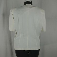 "Bust: 22\" Shoulder: 17.5\" Blouse Length: 22.5\" Waist: 15.5\" Inseam: 29\" Pants Length: 42.5\" All measurements are taken straight across, chest and waist are not doubled. Length is measured from the back of the neck to the hem. Suit set is in good preowned condition, no major stains (light makeup stain on chest), odors or tears ( small snag on left knee). May have minor imperfections - see pictures for details." Classic Fitted Blouse With Pockets, Formal Tailored Top With Pockets, Tailored Formal Top With Pockets, Classic Formal Tops With Notch Lapel, Formal Tailored Blouse With Pockets, Formal Fitted Blouse With Pockets, Fitted Formal Blouse With Pockets, Tailored Short Sleeve Formal Tops, Formal Cream Short Sleeve Top