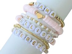 Fun, feminine stretchy name, initial or word bracelets make the perfect outfit accessory! Mix and match the beautiful light pink word bracelets with our accent bracelets for a pop of gold to dress up your bracelet stack.   Each bracelet sold separately ** 👉🏻Bracelets are made with high quality hypoallergenic 18k gold filled spacer beads, heishi beads, and brass beads 📌INSTRUCTIONS: 1. From the Dropdown Menu: >> * SELECT appropriate "Bracelet Length" **Please see photo provided for wrist measurement instructions. Each bracelet is custom made to size. If ordering as a gift, please measure your own wrist and give best educated guess. (Average wrist size is between 6.5-6.75" for reference.) If you have any questions about sizing, please message seller. >> * SELECT from "Bracelet Style" 2. I Pink Word, Bracelet Heishi, Keep Bracelet, Polymer Clay Bracelet, Stackable Jewelry, Nickel Free Jewelry, Word Bracelet, Ball Bracelet, Popular Jewelry