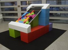 a building made out of legos and colored blocks