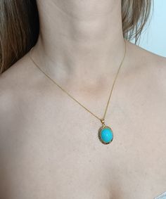 14K Gold pendant features an oval cabochon natural Turquoise gemstone surrounded by a 14K Gold Greek Key design setting.  Pendant hangs from a 1 mm 14K Gold chain. Pendant length 3.6 cm (1.4 inches) Turquoise stone dimension 15 x 10 mm; height 8.8 mm Gold setting thickness 1 mm Gold weight 3.80 grams Chain length 45 cm (17.7 inches), 1 mm wide Gold weight 1.2 grams Pendant and chain may be sold separately: Pendant price 265.00 Euros Chain price 65.00 Euros Please contact me Handcrafted - one of Classic Turquoise Oval Cabochon Jewelry, Elegant Turquoise Gemstone Necklace With Oval Pendant, Elegant Oval Turquoise Gemstone Pendant Necklace, Elegant Turquoise Oval Pendant Necklace, Fine Jewelry Turquoise Oval Necklaces, Fine Jewelry Oval Turquoise Necklace, Elegant Yellow Gold Turquoise Necklace With Cabochon, Oval Cabochon Necklaces In Fine Jewelry Style, Elegant Yellow Gold Turquoise Cabochon Necklace