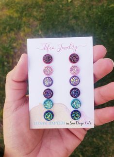 These Faux Druzy Earring Studs are absolutely gorgeous and made with high quality materials, just read our raving reviews from customers! They are lightweight, one-of-a-kind designed by me and Addy, unique, eye-catching, and beautiful. They shine and shimmer from every angle! The perfect birthday gift, or everyday wear! This is a 6 earring palette set. And comes with the following colors; -Berry rose gold - Rose Gold, Raspberry & gold colored druzy, set in a rose red earring post. -Light pink & light pink iridescent druzy set in a light pink earring post -Magenta -Magenta druzy with copper & slate blue notes, set in a red wine earring setting -Blue crystal -blue druzy with green & yellow notes, set in a blue earring setting -Lavender -purple lavender iridescent druzy, set in a light purple Nickel-free Multicolor Earrings For Birthday, Multicolor Round Earrings For Birthday, Multicolor Jewelry With Matching Earrings For Birthday, Purple Hypoallergenic Jewelry For Birthday, Adjustable Hypoallergenic Earrings For Birthday, Multicolor Hypoallergenic Jewelry For Birthday, Hypoallergenic Multicolor Jewelry For Birthday, Hypoallergenic Round Earrings For Birthday, Earring Stud Set