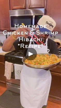 a man in a kitchen holding a pan with food on it and the words homemade chicken & shrimp hibi omelet recipe