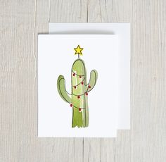 a card with a green cactus on it and a star in the top right corner