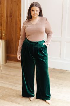 These Velvet Elvis Velvet Pants feel ultra-luxe and are guaranteed to make a bold statement. Cut from emerald velvet with a high-rise waist and wide-leg silhouette, this elegant piece is perfect for elevating any look. Wear yours to make a fashionable impression! Velvet High Rise Clasp and Button Closure Zip Fly Elastic Back Waistband Pockets Wide Leg 95% Polyester, 5% Spandex True to Size S: Waist 28" Hips 46" Rise 12" Inseam 30"M: Waist 30" Hips 48" Rise 12.5" Inseam 30"L: Waist 32" Hips 50" R Wide Leg Velvet Pants, Velvet Elvis, Emerald Velvet, Glitter Bomb, Velvet Blouses, Judy Blue Jeans, Velvet Pants, Satin Top, Denim Leggings