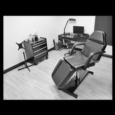 black and white photograph of two office chairs