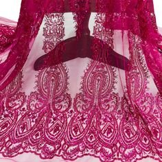 a pink dress with an intricate design on it