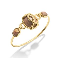 Inspired by my globe-trekking and fabulous French aunt, this classic chain bracelet personifies her effortless-yet-impeccable style that she achieves everyday. Featuring a subtly ornate gold motif complemented by earthy teak beads, this bracelet is perfect for life’s many adventures, from museum galas to mountaintop picnics. Elegant Brown Stackable Jewelry, Earthy Gold Jewelry For Everyday, Earthy Everyday Gold Jewelry, Adjustable Earthy Gold Jewelry, Everyday Brown Stackable Jewelry, Everyday Stackable Brown Jewelry, Earthy Gold Jewelry, Gold Motif, Hinged Bracelet