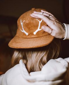 The Classic Antler Cap is a 6 panel, made from 100% organic corduroy cotton. Featuring our classic embroidered antlers to the front and Harrison & Wild Co. text embroidered to the reverse. Finished off with our antler embossed metal clasp, to fully adjust to most head sizes. FEATURES . 100% organic corduroy . Classic 6 panel style . Metal embossed buckle . Adjustable strap fits most. CARE INSTRUCTIONS . Wash cycle 30o or under   (hand wash preferred) . Hang dry to keep shape or tumble dry low . Wash with similar colours . Do not iron over embroidery Actual product color may vary from the images shown. Winter Corduroy Baseball Cap With Curved Brim, Winter Cotton Baseball Cap With Flat Brim, Cotton 5-panel Winter Hats, Corduroy Winter Cap, Winter Corduroy Hat With Curved Brim, Winter Cotton Snapback Hat With Flat Brim, Winter Cotton Snapback Hat With Curved Brim, Brown Winter Snapback Hat, Winter Snapback Hat