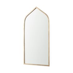 an arched mirror on the wall with a white back ground and gold trim around it