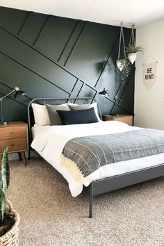 a bed room with a neatly made bed and a plant on the side of the bed