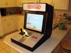 an old nintendo game sitting on top of a kitchen counter