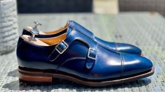 Handmade Premium Quality Leather Blue Colour Cap Toe Monk Strap Men Shoes ❤ Upper Material👉 Genuine Calf Leather ❤ Inner Linings👉 Soft Leather ❤ Style👉Cap Toe Monk Strap Men Shoes ❤ Colour👉 Blue ❤ Sole👉 Leather ❤ Gender👉 Male ❤ Heel👉 Leather ❤ Totally Hand stitched 👍 Manufacturing Time 12 to 14 Business Days Accessories may differ Sometime a little from original picture due to availability Coloured rubber out sole extends durability and longevity of these striking men's dress shoes LOAFER These comfortable slip-on shoes were invented at the turn of the 20th century and are considered offshoots of moccasins. The shaft of the loafer continues down under the length of the foot and is sealed on top with a vamp insert. Loafers also feature an out sole and a heel. CALF Skin This shoe's u Blue Leather Monk Strap Shoes With Plain Toe, Blue Leather Monk Strap Shoes, Blue Monk Strap Shoes With Leather Sole, Classic Blue Monk Strap Shoes With Leather Sole, Classic Blue Monk Strap Slip-on Shoes, Classic Blue Slip-on Monk Strap Shoes, Mens Loafers, Custom Design Shoes, Leather Boot Shoes