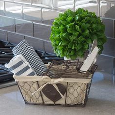 a potted plant sitting on top of a counter next to kitchen utensils