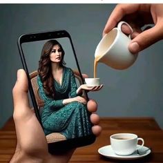 a woman pouring coffee into a cup on top of a table next to a cell phone