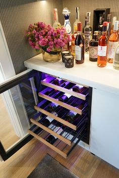 a wine rack with several bottles in it